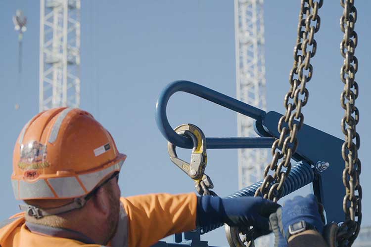 crane forks attached to crane with a chain sling