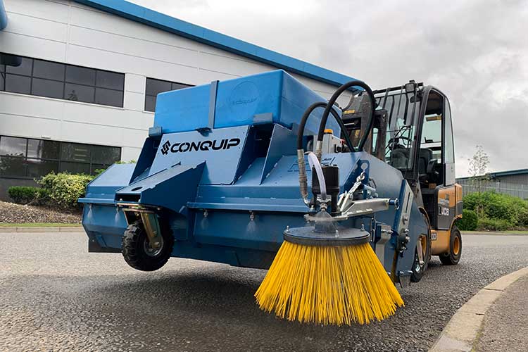 forklift road sweeper attachment on a forklift