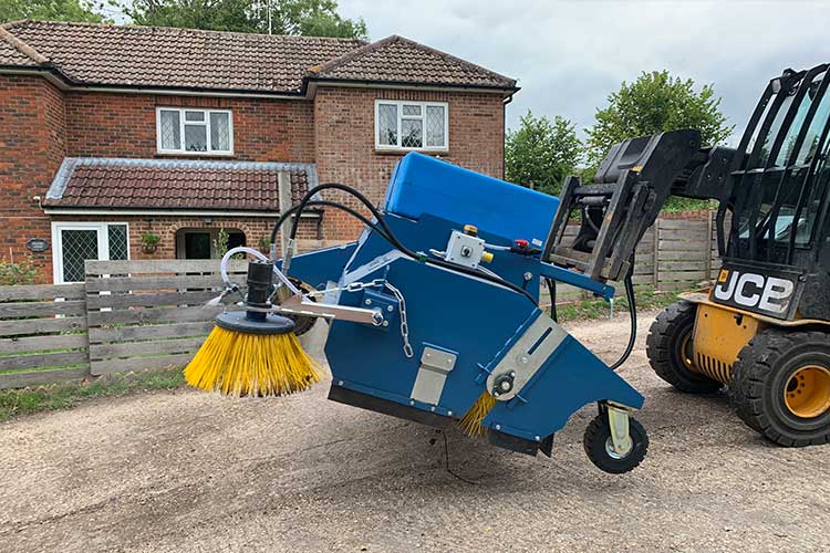 demonstration of powerbrush forklift road sweeper attachment on a forklift